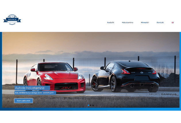Picture of one red and one black sportscar by the sea - such is the cover of Hobihoid company - they ordereded website development from us